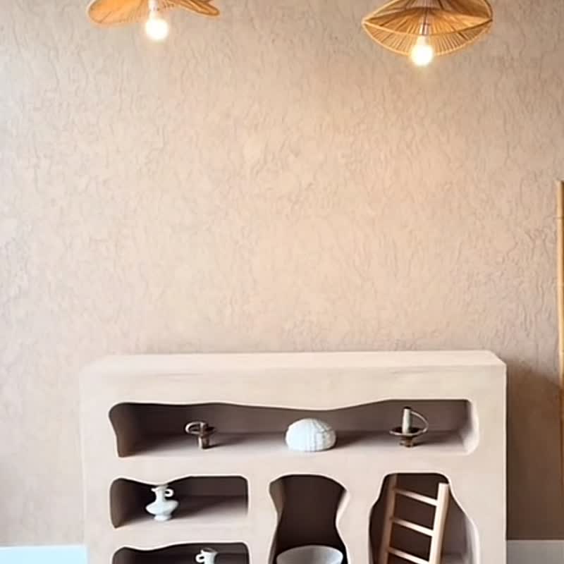 Built and finished for the Bilatiis studio, in a travertine finish with curved shelves.